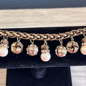Elegant Gold and Cream Charm Bracelet